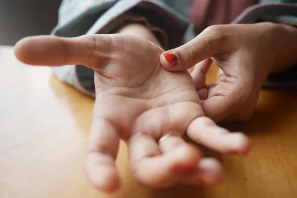 A zoomed image of a hand palming and reading